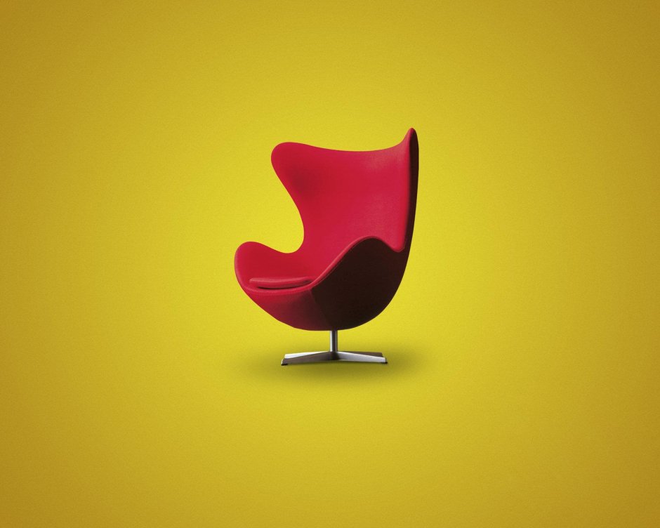 Красное кресло на черном фоне