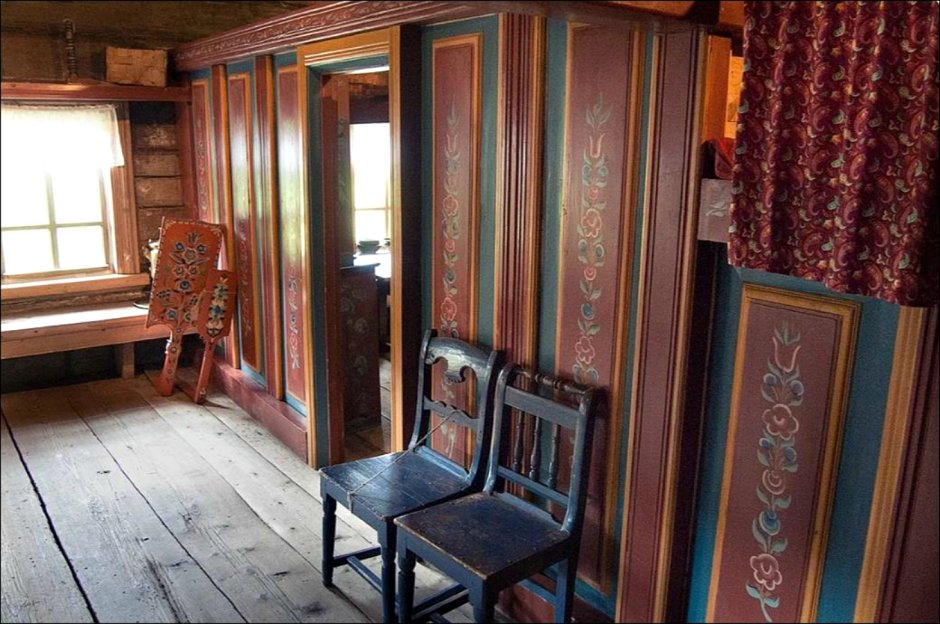Интерьер спальни в бревенчатом доме в деревенском стиле