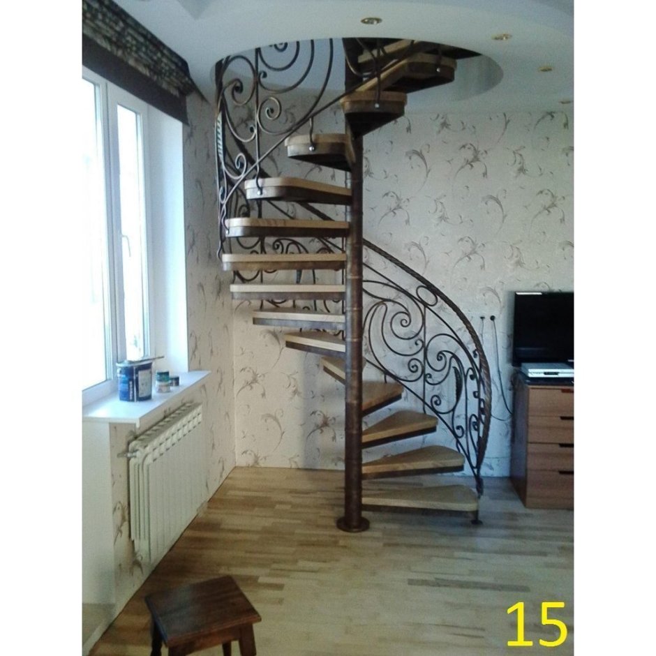 Кованые винтовые лестницы с деревянными ступенями