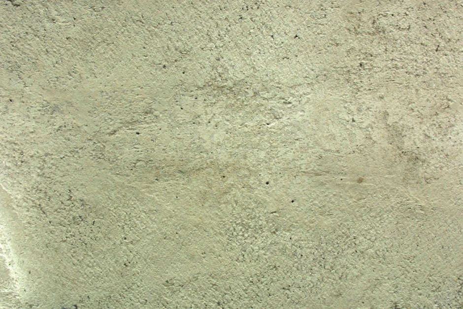 Облезлая штукатурка на зелёном фоне