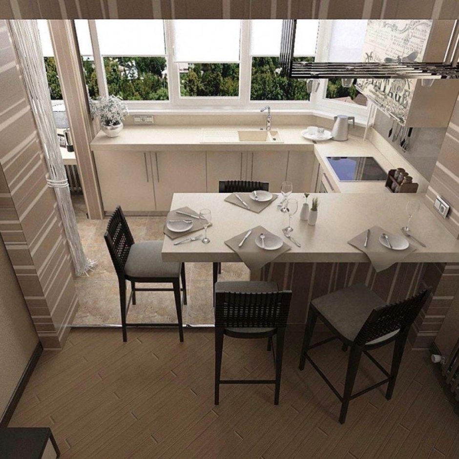 Обеденный стол между кухней и балконом