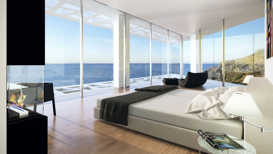 Спальня с панорамными окнами с видом на море