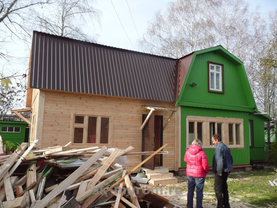 Двухэтажная пристройка к деревянному дому