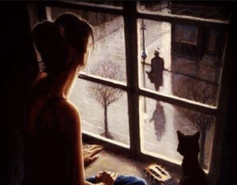 Девушка с чашкой кофе у окна