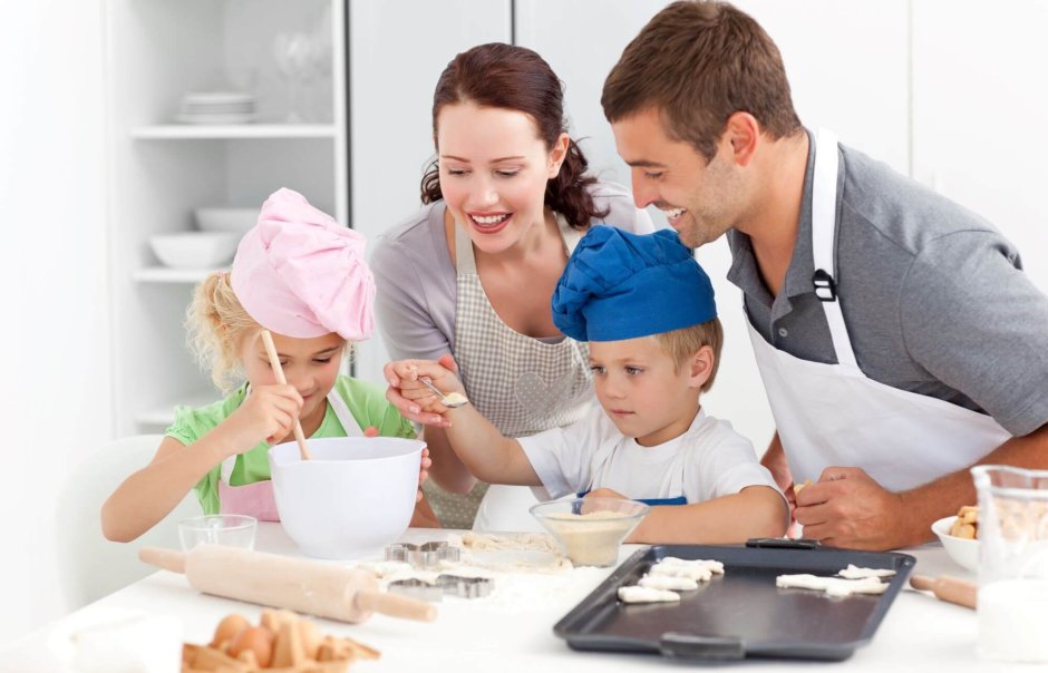 A Family Cooking at Home