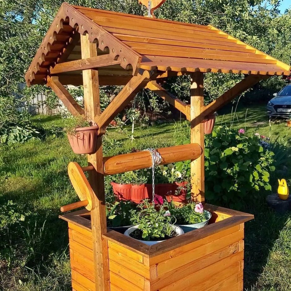 Клумба колодец