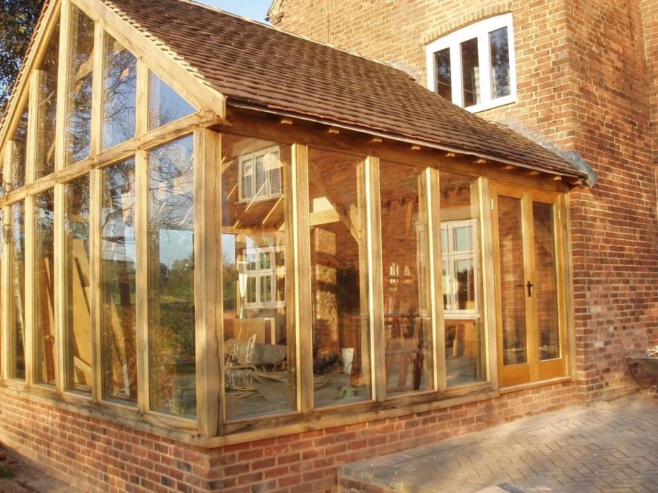 Веранда пристроенная к дому застекленная