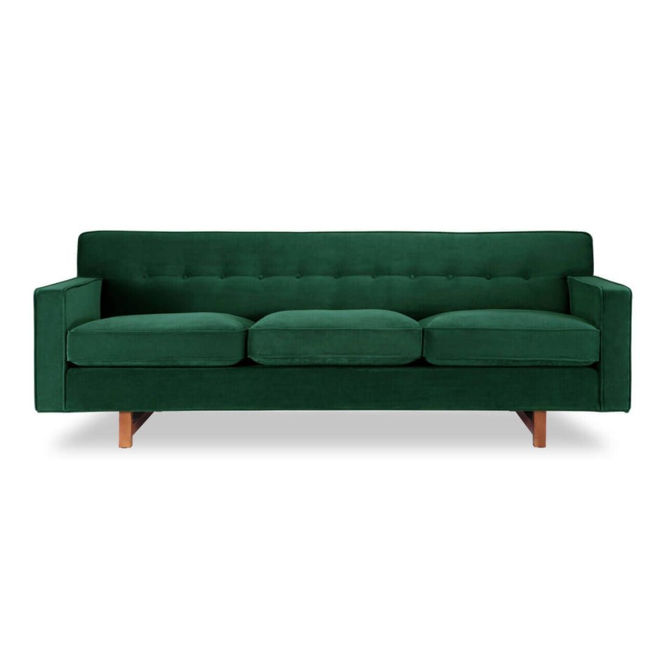Темно-зеленый диван в интерьере