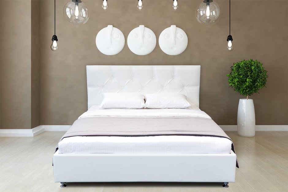 Кровать белого цвета в спальню