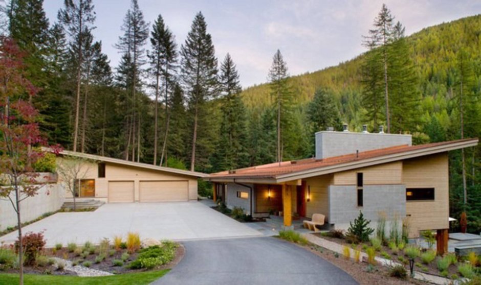 Дом на склоне гараж сверху