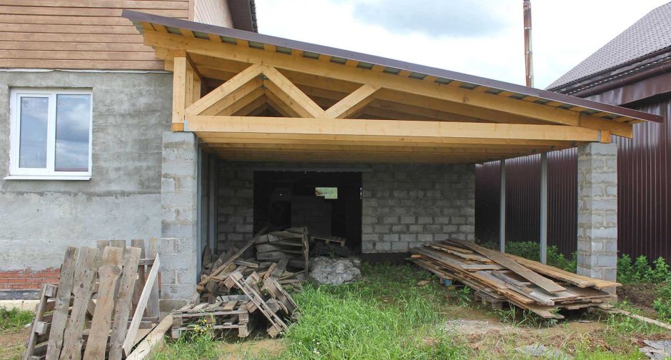 Деревянный дом из бруса с гаражом: проекты и фото