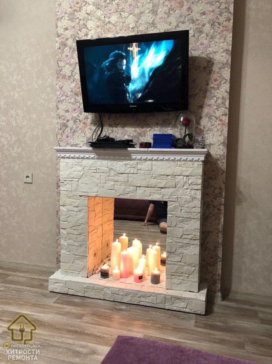 Декоративный камин с телевизором в квартире