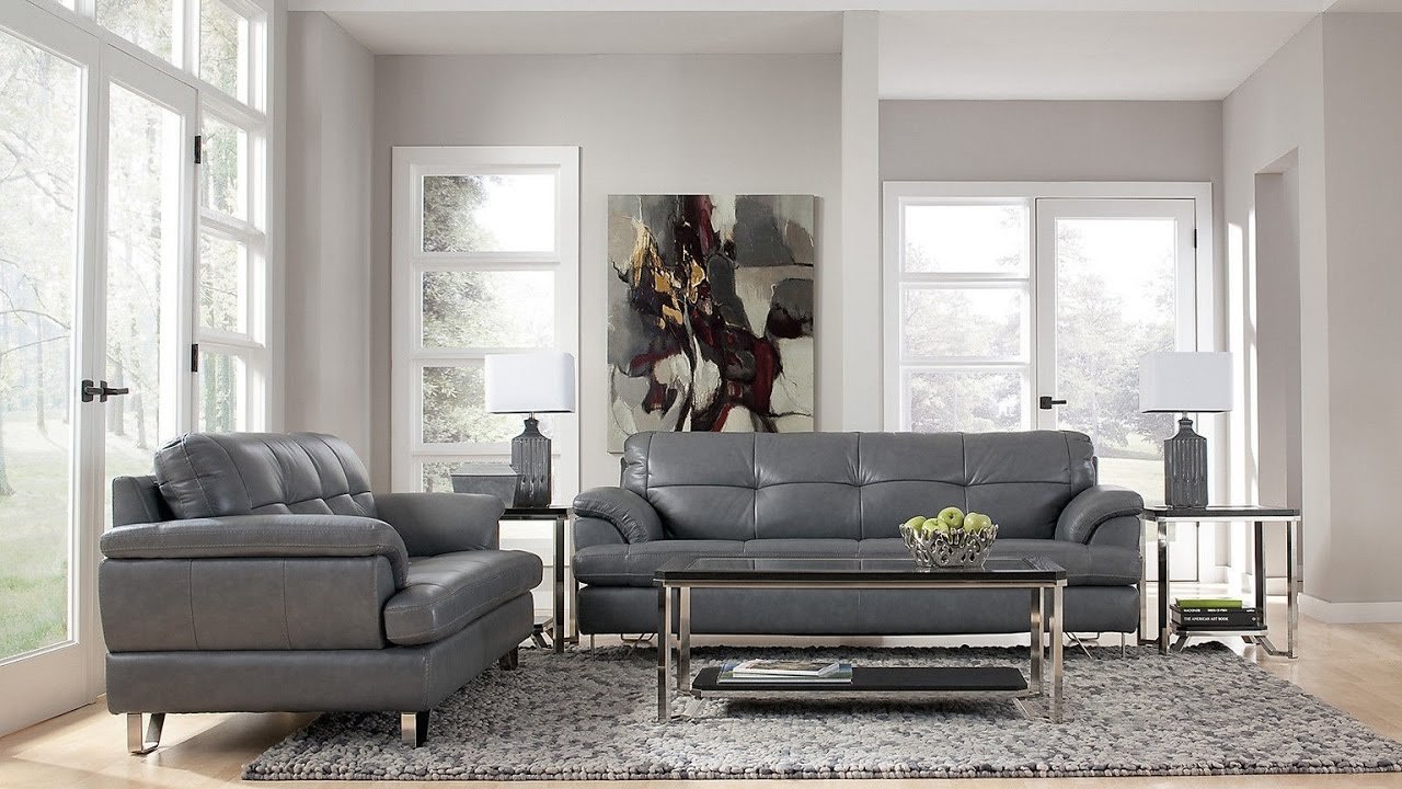 Серый кожаный диван в интерьере