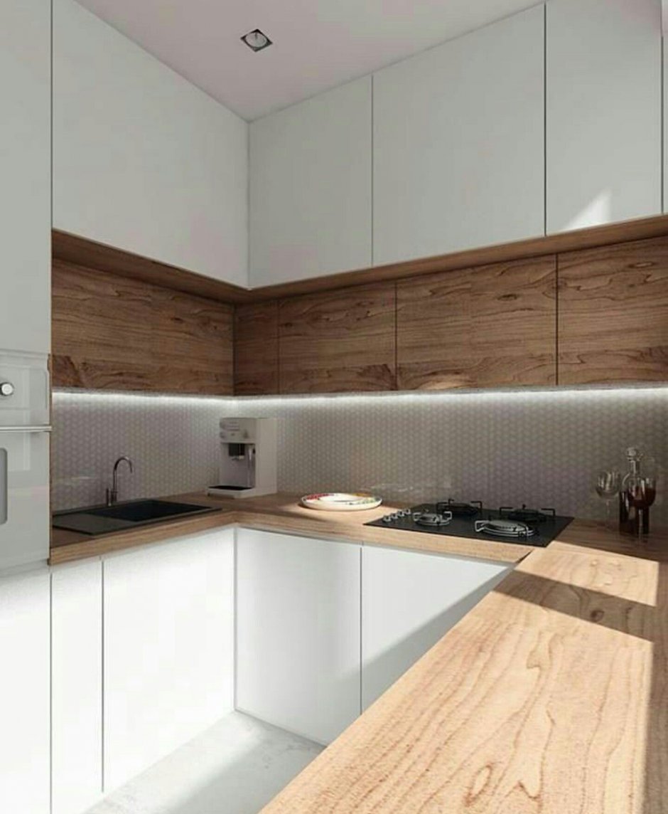 Белая угловая кухня с деревянной столешницей