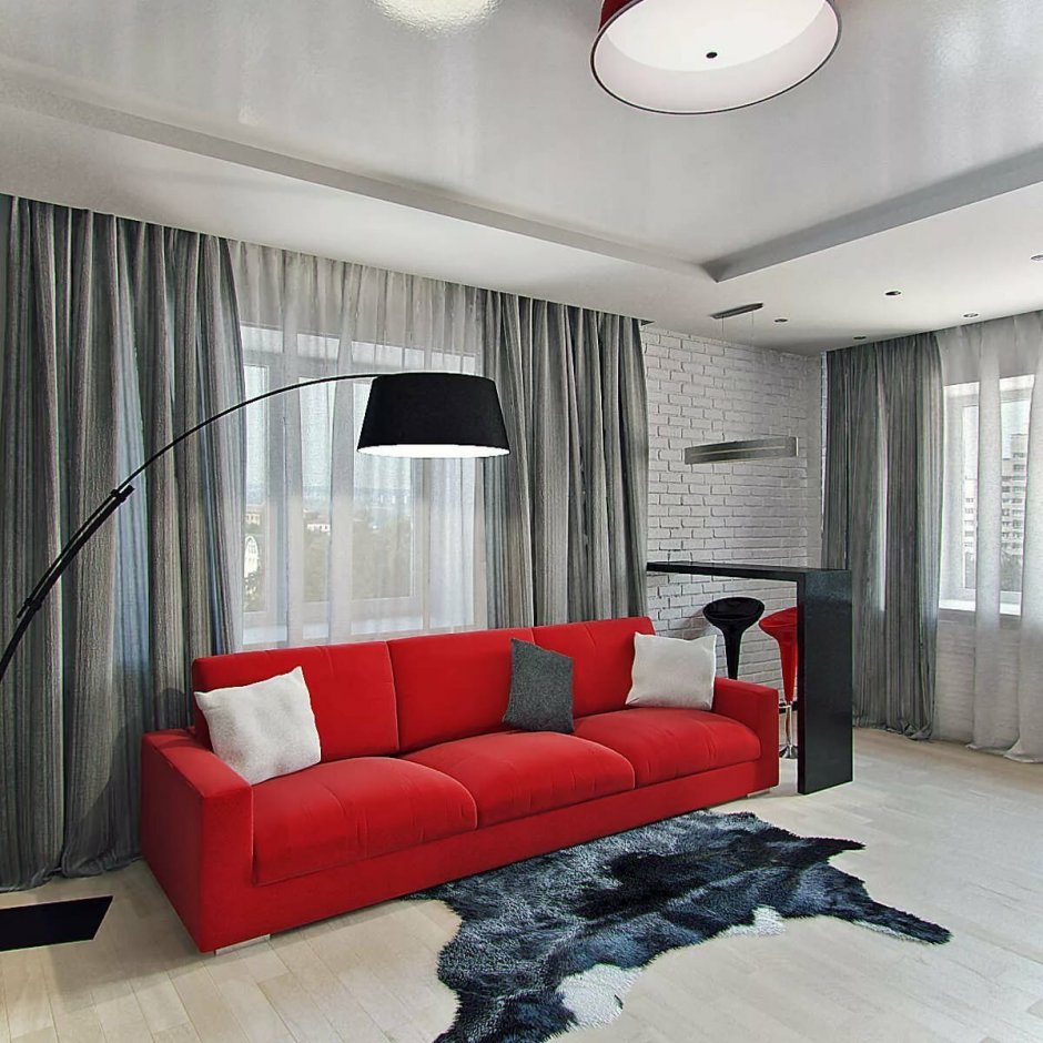 Интерьер зала с красным диваном