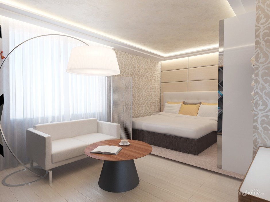 Зонированная гостиная со спальней с серым диваном