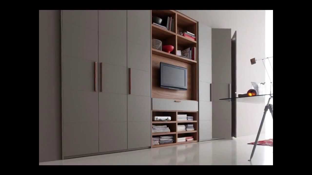 Телевизор встроен в шкаф. Шкаф armadio Wardrobe. Потайной шкаф в гостиной. Вместительный шкаф в гостиную. Шкаф в современном стиле.