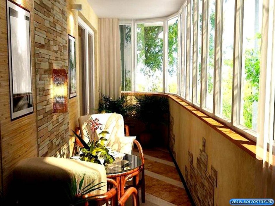 Интерьер балкона с креслом кроватью