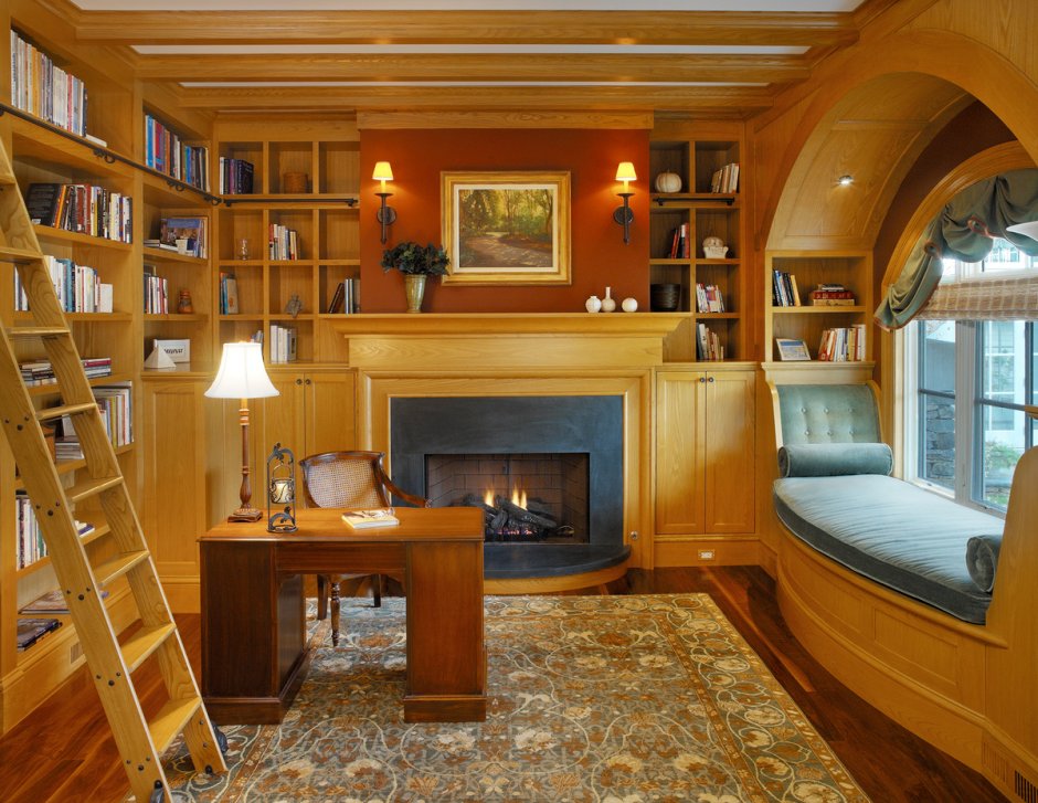 Домашняя библиотека с камином