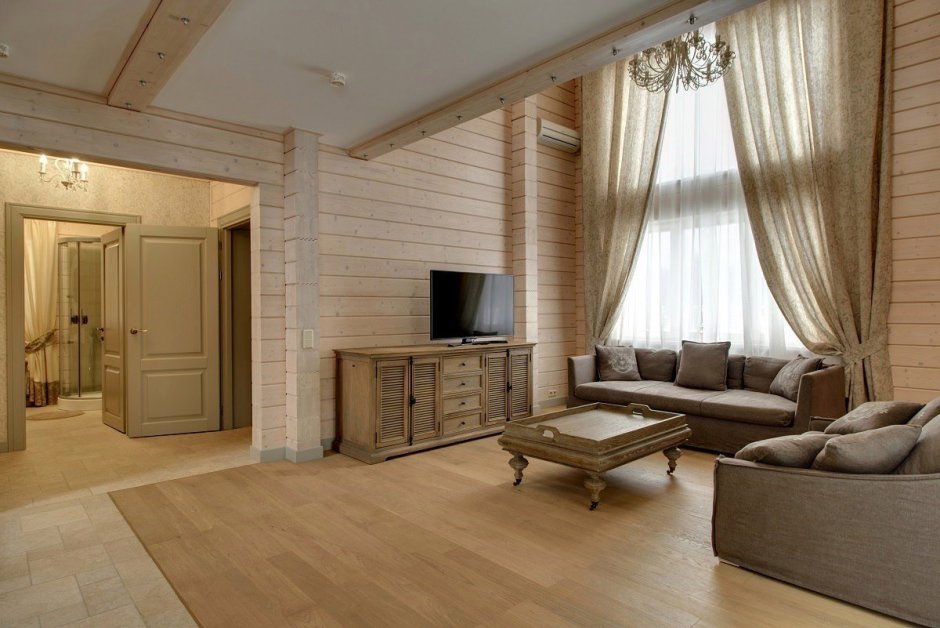 Интерьер спальни в деревянном доме из бруса