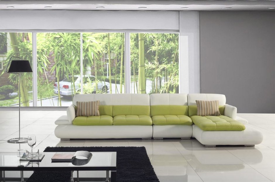 Зеленый угловой диван в интерьере