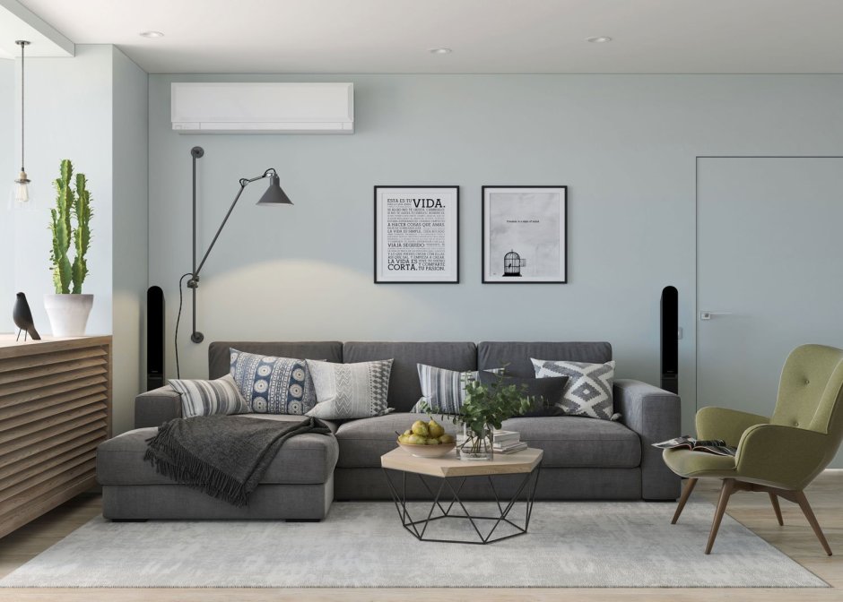 Серый диван в гостинной в скандинавском стиле