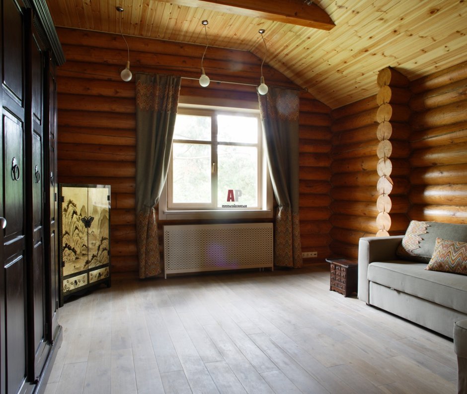 Гостиная в деревянном доме в коричневых тонах