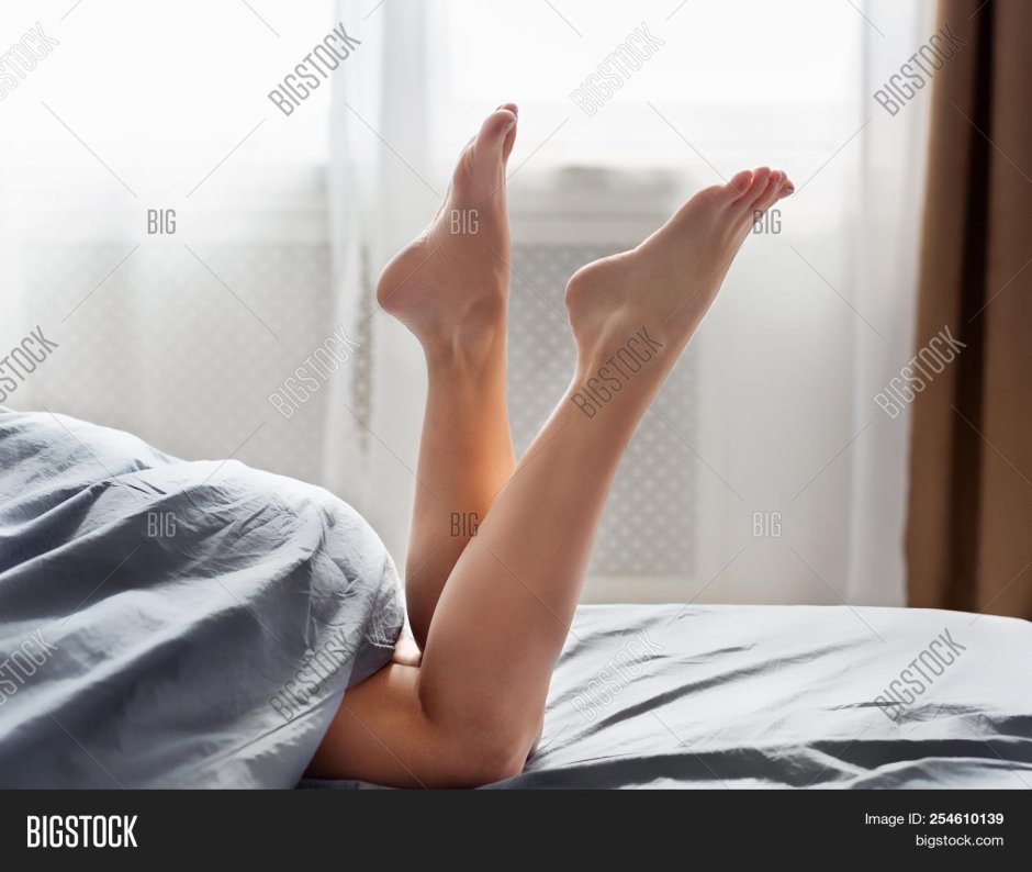 Barefoot women on Bed Relax