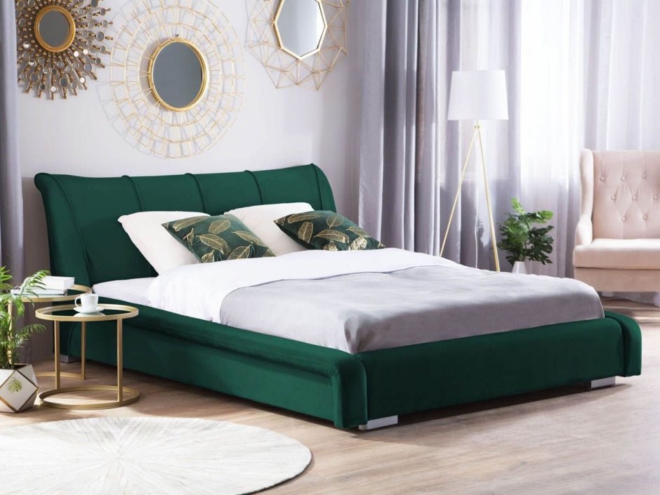 Зеленая кровать с мягким изголовьем в интерьере