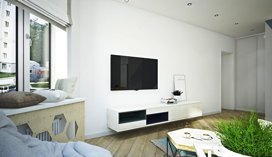 Белый телевизор на белой стене