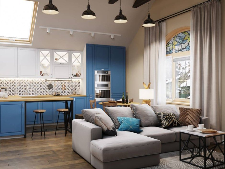 Синий диван в интерьере гостиной совмещенной с кухней