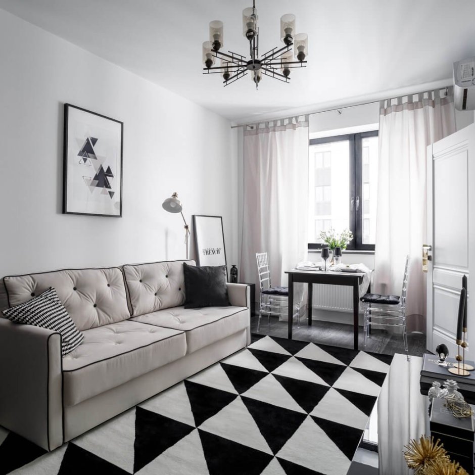 Черно-белая мебель в интерьере гостиной