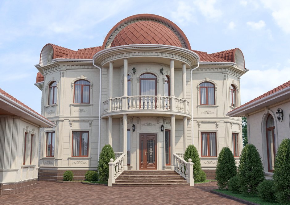 Отделка дома дагестанским камнем с красной крышей