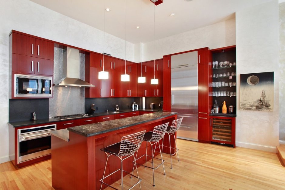 Кухня-гостиная в современном стиле с красной кухней